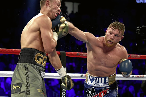 Saul Canelo Alvarez throws a punch at Gennady Golovkin. The Mexican had a positive drug test.