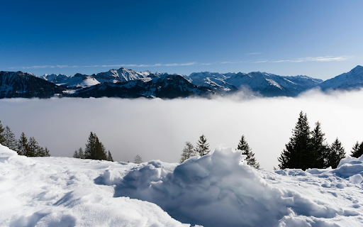 Breathtaking view of the snow-covered Swiss Alps and misty valleys screenshot 1