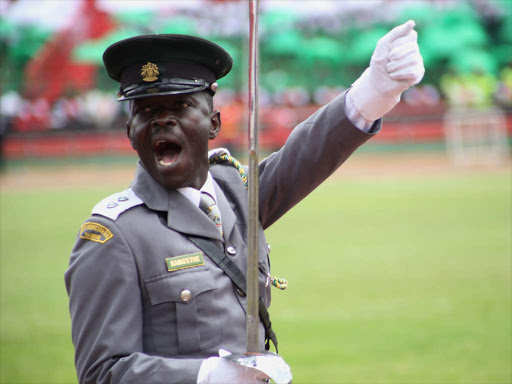 A commander from the Nairobi county askari marches past the presidential dais during celebrations to mark mashujaa day at the Nyayo stadium yesterday.HEZRON NJOROGE