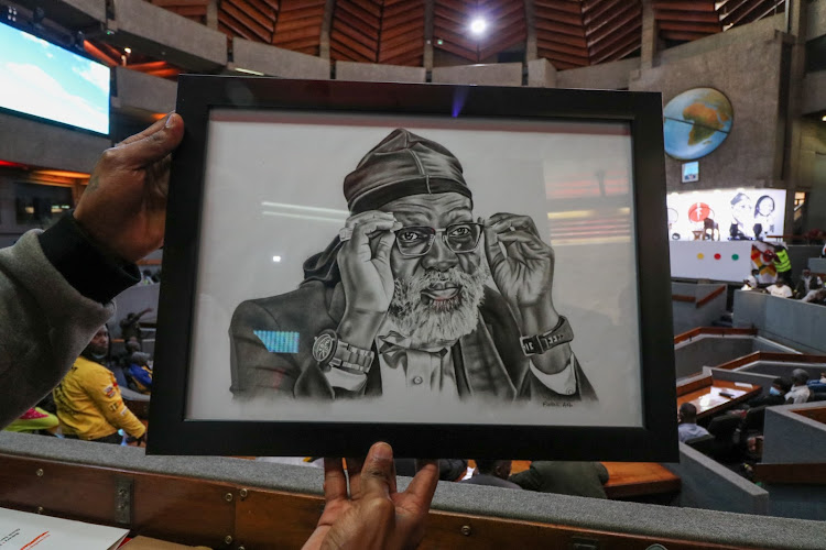 Patrick Wachira alias Pattoh Art attending the Prof George Wajackoya's manifesto. He is behind this pencil portrait.