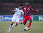 Keenan Phillips of Supersport United challenged by Simpiwe Ndlovu of Platinum City Rovers.