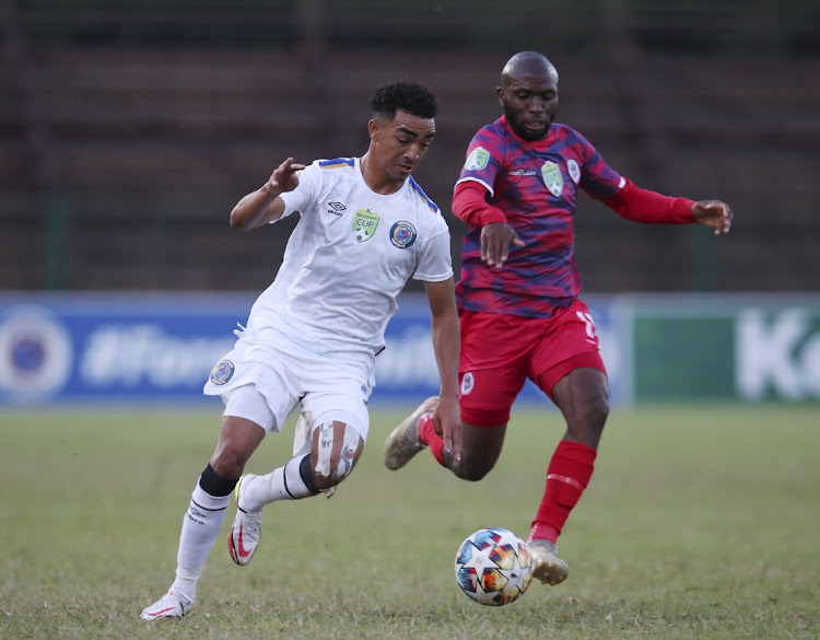 Keenan Phillips of Supersport United challenged by Simpiwe Ndlovu of Platinum City Rovers.