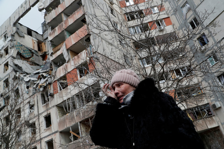 A woman reacts while speaking near a block of flats, which was destroyed during Ukraine-Russia conflict in the besieged southern port city of Mariupol, Ukraine March 17 2022. Picture: ALEXANDER ERMOCHENKO/REUTERS