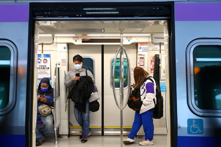 People wear protective masks to prevent the spread of the coronavirus disease (Covid-19) while riding the metro in Taoyuan, Taiwan, January 25, 2021.