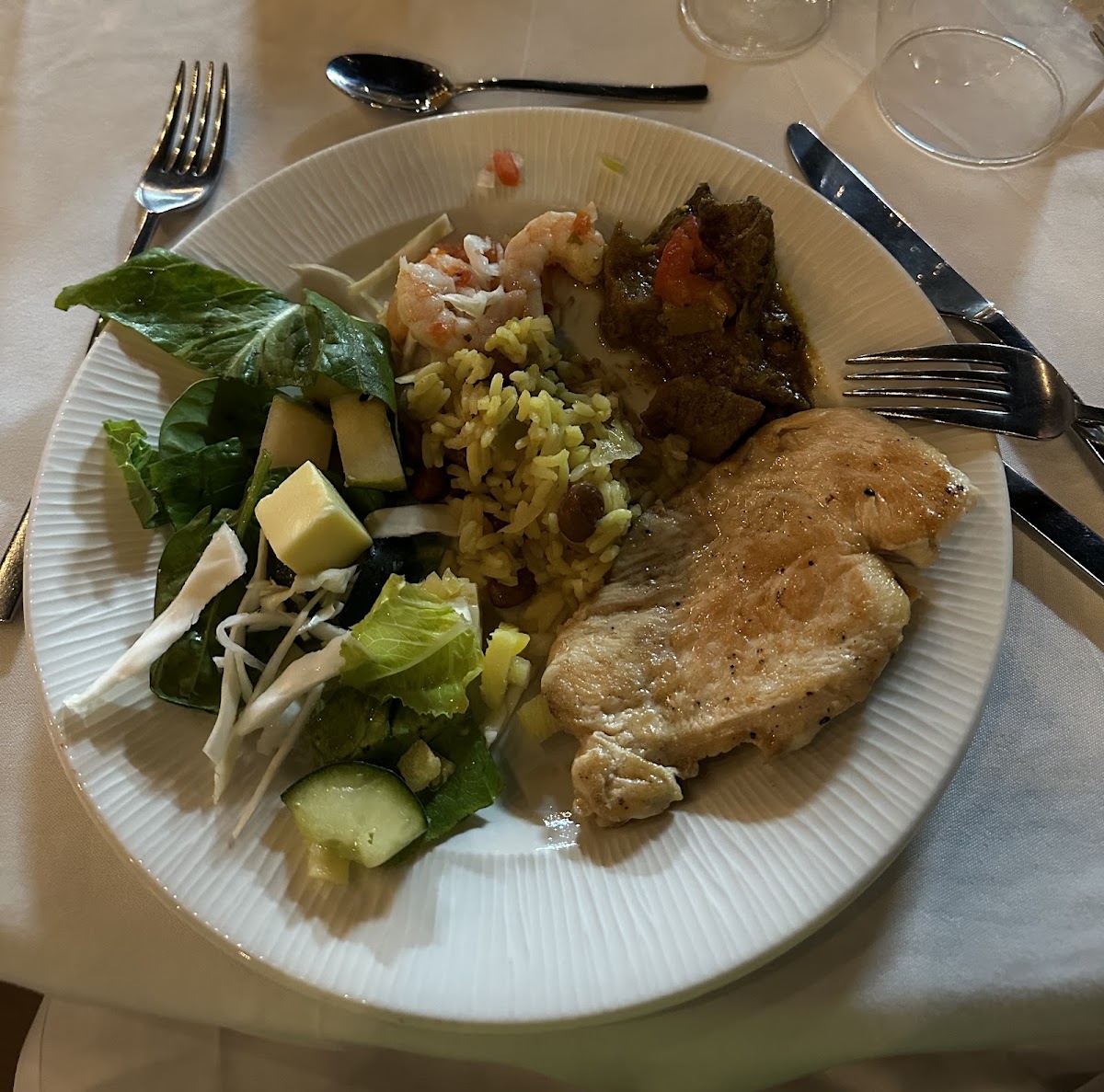 Wedding dinner food- salad, rice, chicken, goat stew, shrimp