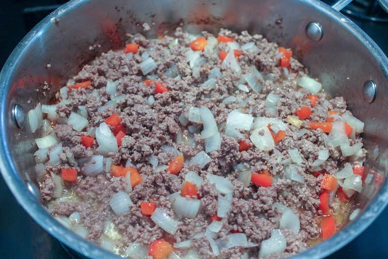 Browning Beef With Onion And Bell Pepper.