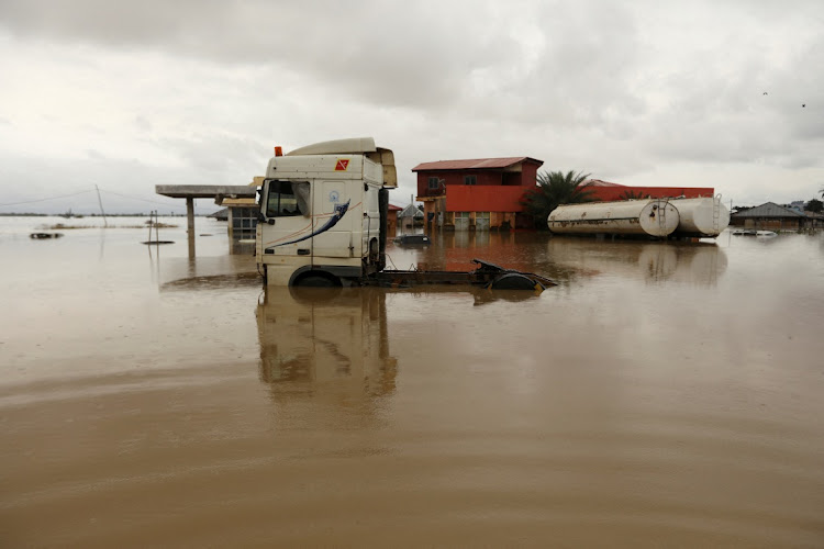 Vehicles are seen submerged in flood water at a petrol station in Lokoja, Nigeria in this October 13 2022 file photo. REUTERS/AFOLABI SOTUNDE