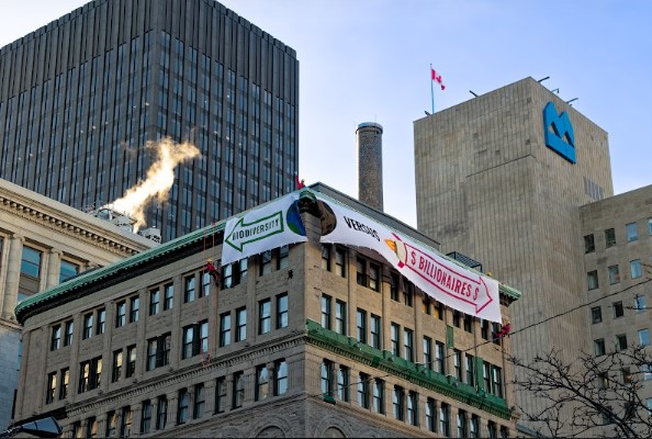 Activist climbers dropped banners at the COP15 biodiversity conference to warn delegates that mega-billionaires such as Amazon founder Jeff Bezos and Microsoft founder Bill Gates are "perversely influencing global decisions about biotechnology".