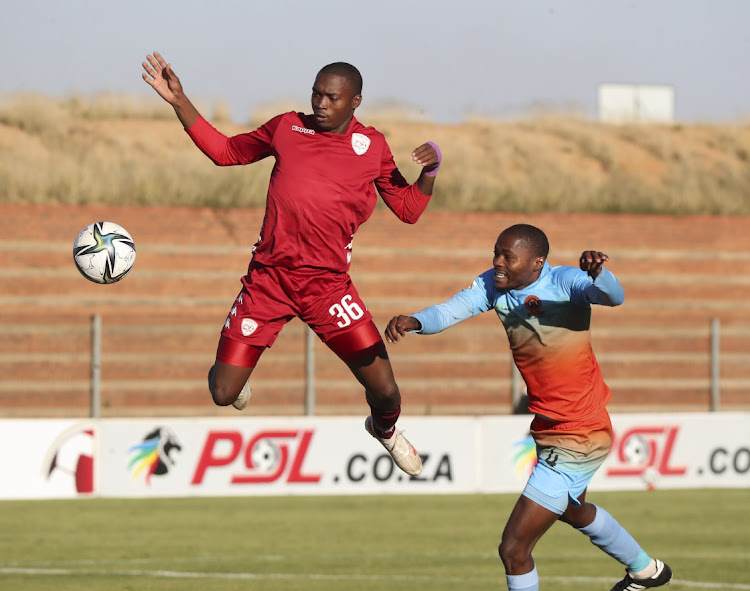 Thabang Sibanyoni of Sekhukhune United is challenged by Eden Nene of Polokwane City during the GladAfrica Championship match at Makhulong Stadium, Tembisa, on May 16 2021.