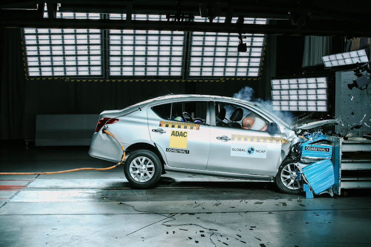 The Nissan’s driver seat partially detached from the rail during the crash test.