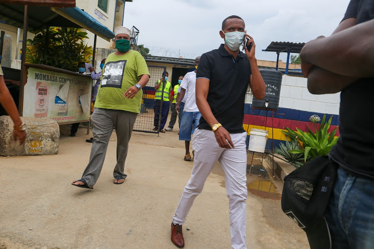 Mombasa Jubilee politician Mohamed 'Tenge' Salim and Nyali MP Mohammed Ali walk out of Mtwapa police station in Kilifi county on Tuesday, May 19, 2020