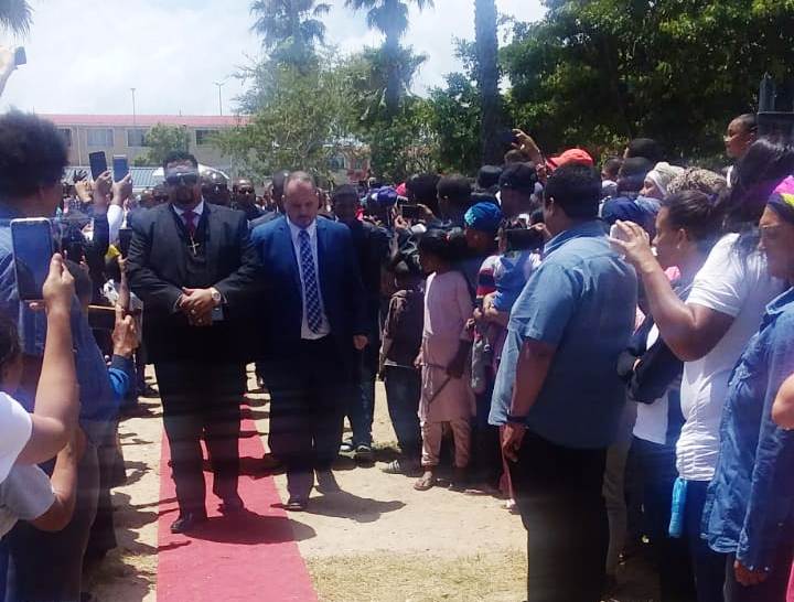 Manenberg residents line a red carpet as pall-bearers carry Rashied Staggie's coffin towards a tent at The Greens on December 21 2019.