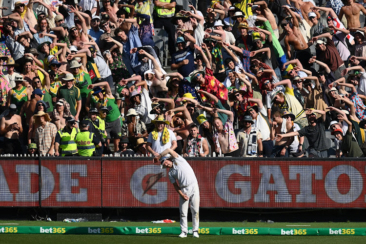 The crowd copies Anrich Nortje of South Africa as he warms up on day two of the second Test against Australia at the Melbourne Cricket Ground on December 27 2022.