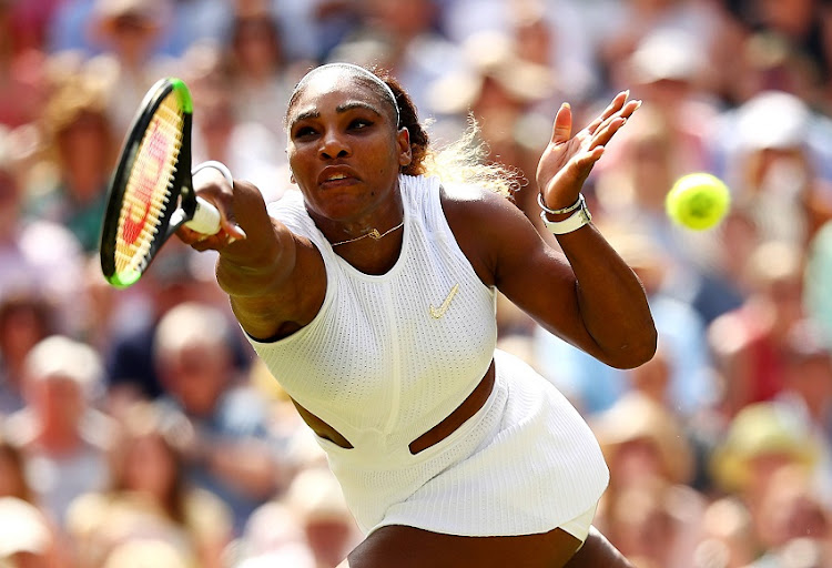 Serena Williams of The United States stretches to play a forehand in her Ladies' Singles semi-final match against Barbora Strycova of The Czech Republic during Day Ten of The Championships - Wimbledon 2019 at All England Lawn Tennis and Croquet Club on July 11, 2019 in London, England.