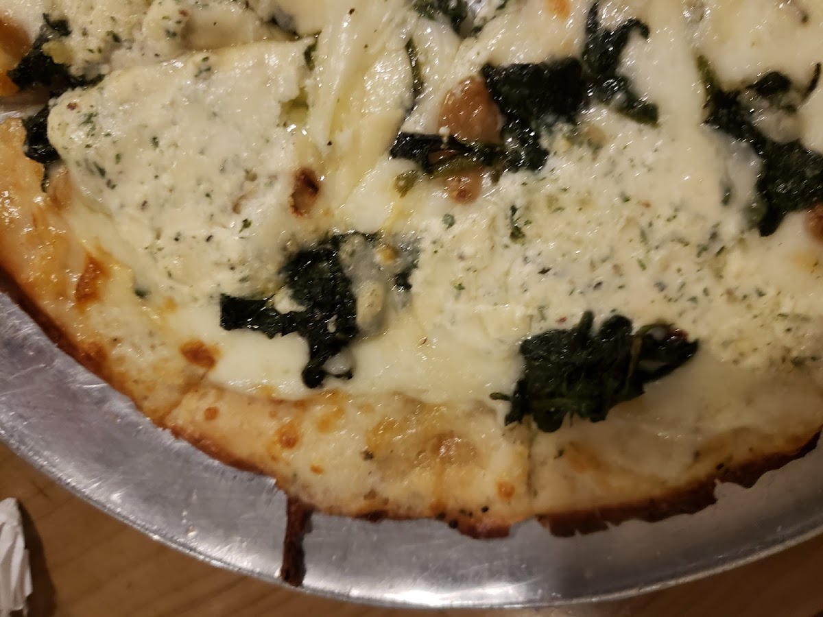 Popeye...herb infused oil base, ricotta cheese, spinach, roasted garlic and shaved parm! Next time I'll add bacon but this was fabulous!!