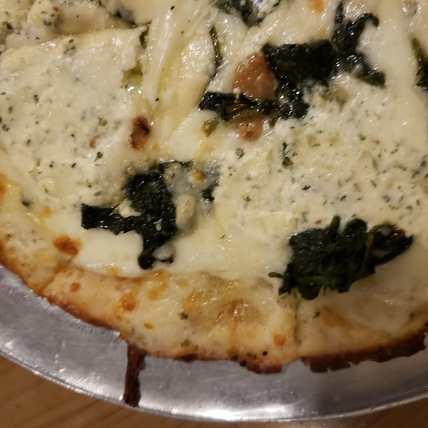 Popeye...herb infused oil base, ricotta cheese, spinach, roasted garlic and shaved parm! Next time I'll add bacon but this was fabulous!!