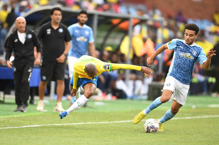 Thapelo Morena of Mamelodi Sundowns loses out in a challenge against Mohamed Fathi of Pyramids FC in the Caf Champions League Group A match at Loftus Versfeld in Pretoria on Sunday. Picture: LEFTY SHIVAMBU/GALLO IMAGES