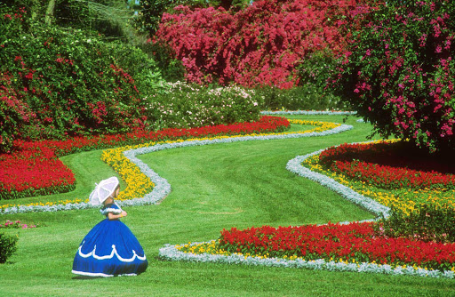 Southern-Belle-in-Garden.jpg - Guests sailing to Louisiana aboard American Heritage will get a chance to visit the antebellum estate Houmas House.