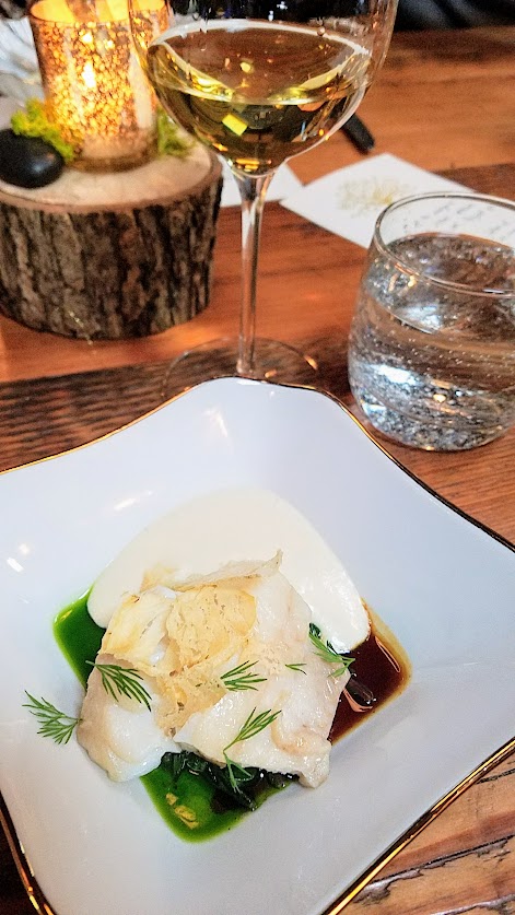 Fimbul Icelandic Dinner Spring 2018, Cod with dandelion, birch, potato - the cod is poached and also in chip form and the sauces are the dandelion greens and birch syrup below with potato foam.