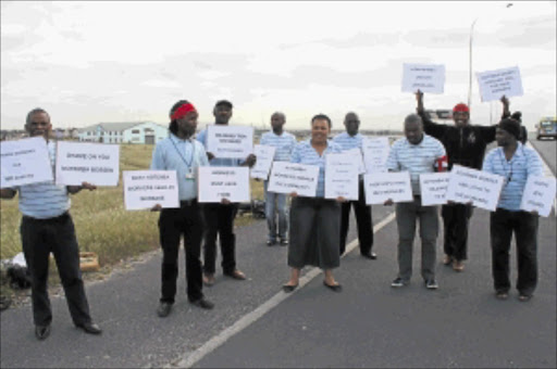 INDUSTRIAL ACTION: Nothemba Funeral Services workers picket outside the company's offices in Khayelitsha. PHOTO: LUTHO QWAMBI