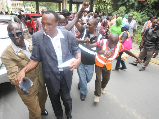 Dock Workers’ Union secretary general Simon Sang (2nd L) is flanked by supporters after he emerged the winner during KPA elections with 2,701 votes, against Bakari Bwete who managed 500 votes, on April 13 last year /ELKANA JACOB