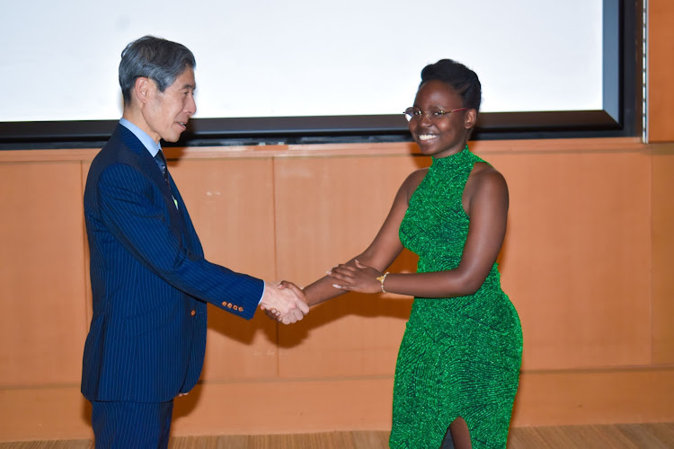 Japanese Ambassador Ken Okaniwa with Holiness Ange Igiraneza from Burundi, the 2022 overall winner of the ‘Do the right thing’ essay writing contest in Kenya, during the award ceremony at the Japanese Embassy in Nairobi on December 5, 2022.