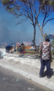 The scene at an informal settlement in KwaZakele, near Port Elizabeth, where about 20 shacks burnt down on Sunday.