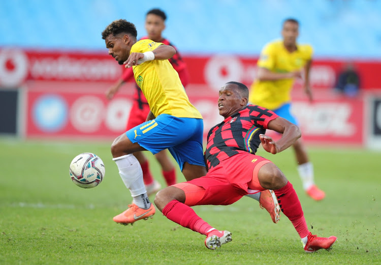 Kermit Erasmus of Mamelodi Sundowns tackled by Mlungisi Mbunjana of TS Galaxy during the DStv Premiership 2021/22 match between Mamelodi Sundowns and TS Galaxy at Loftus Versfeld Stadium, Pretoria, on 19 September 2021.