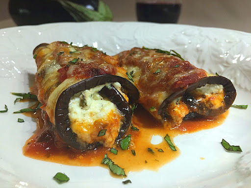 A couple delicious eggplant slices stuffed with cheeses and seasonings