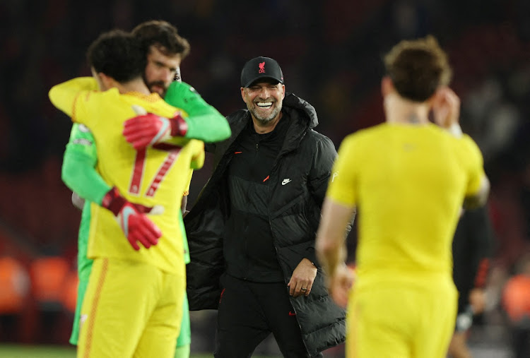 Liverpool manager Juergen Klopp celebrates with their players after the match against Southampton on Tuesday