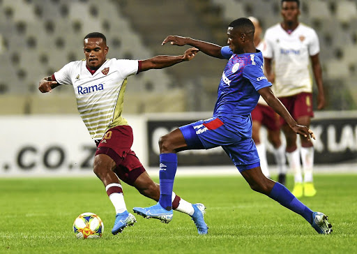 Iqraam Rayners of SFC wards off Thatayaone Ditlhokwe of SuperSport United.