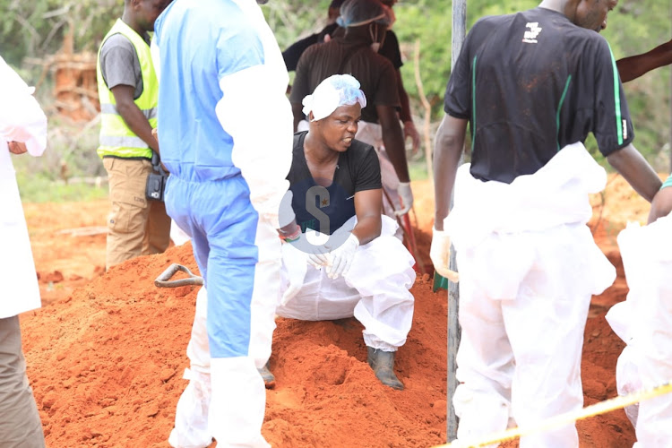 Detectives exhuming bodies in Shakahola forest on June 12, 2023.