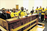 SEQUEL TO VIOLENCE: Nala local municipality mayor Theko Mokgoje, left, 
      
      
      
      
      in the Bothaville Magistrate's Court 
      
       charged with allegedly torching
      
       houses belonging to EFF
      
      
      
      
      members 
       PHOTO:MOHAUMofokeng