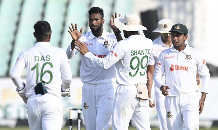 Bangladesh players celebrate the wicket of Ryan Rickelton.