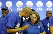 Loyiso Nkohla with Cape Town mayor Patricia de Lille.