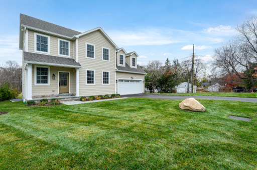 Beige house with lawn and driveway - Buy this luxury house in Stamford, 5 bedrooms