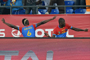 Democratic Republic of the Congo's forward Junior Kabananga (L) celebrates with Democratic Republic of the Congo's defender Chancel Mbemba after scoring a goal during the 2017 Africa Cup of Nations group C football match between DR Congo and Morocco in Oyem on January 16, 2017.