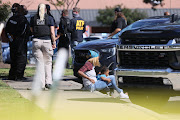 Emergency personnel respond to a shooting at a Kroger supermarket in suburban Memphis, Tennessee, US, September 23, 2021. 