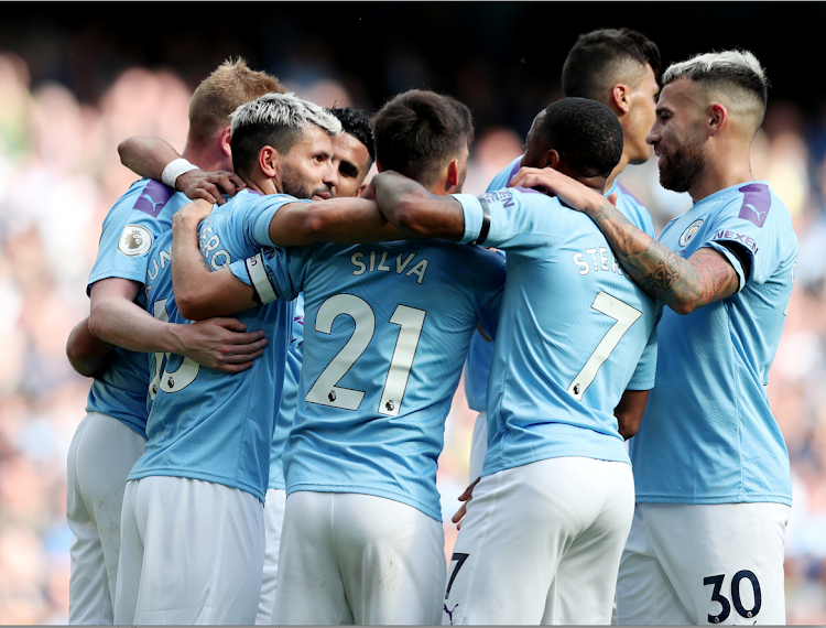 Manchester City players celebrate during a recent match