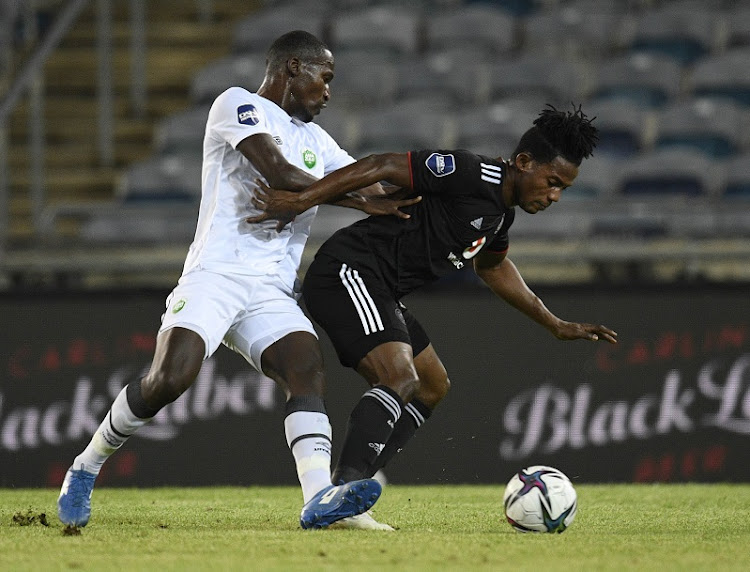 Tapelo Xoki of AmaZulu challenges Kwame Peprah of Orlando Pirates in the DStv Premiership match at Orlando Stadium in Johannesburg on December 23 2021.