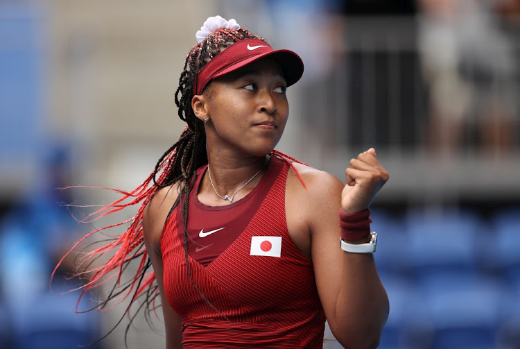 Naomi Osaka of Japan celebrates after winning her women's singles second round match against Viktorija Golubic of Switzerland at the Tokyo 2020 Olympic Games at Ariake Tennis Park on July 26 2021.