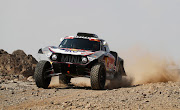  Mini's Stephane Peterhansel leads the rally by 5 min 9 sec from Toyota's Nasser Al-Attiyah.