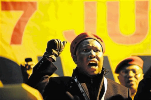 ON THE WARPATH: Julius Malema, seen wearing the trademark beret of the Economic Freedom Fighters, which he will lead into the general elections next year. Malema confiscated 300 of the hats when he raided factories in Pretoria yesterday PHOTO: Tsheko Kabasia