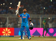 India's Virat Kohli celebrates after reaching his 49th century, equalizing with Sachin Tendulkar's record of most number of ODI centuries.