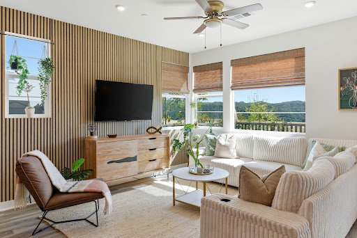 Modern living room with white sofa and wood slat wall in this luxury house for sale in Rancho Mission Viejo ($959,000)