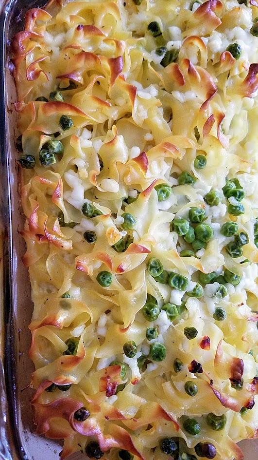 This Savory Cheese Kugel Recipe is my take on the Jewish casserole with egg noodles, butter, eggs, and cheese, with other optional add ins like here, peas and sauteed onions