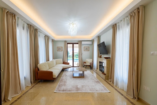 Modern living room with sofa, fireplace, coffee table in this luxury house for sale in Kouklia ($2,074,019 - 169 m²)