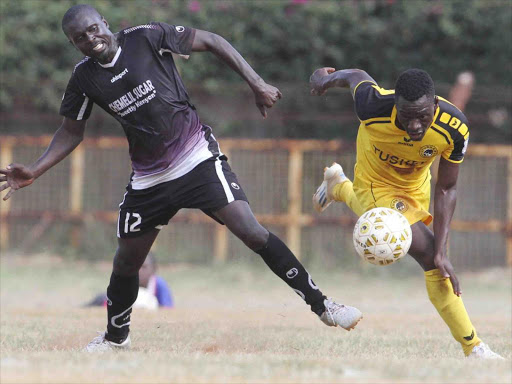 Tusker’s Francis Ochola challenges Chemelil’s Hillary Wandera during their KPL match yesterday /OLIVER MORGAN