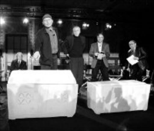 HOLY RELICS? Filmmaker Simcha Jacobovici points to an ossuary - a container in which human bones are stored - that he and others claim might have held the remains of Mary Magdalene. They believe the other ossuary shown to the media at a news conference in New York on Monday held the remains of Jesus. These and other ossuaries were discovered in a suburb in Jerusalem in 1980. Pic. Kathy Willens. 26/02/07. © AP.