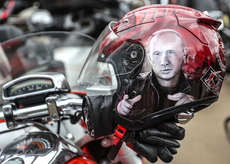 The likeness of Russia's president Vladimir Putin painted on a biker's helmet in Moscow.